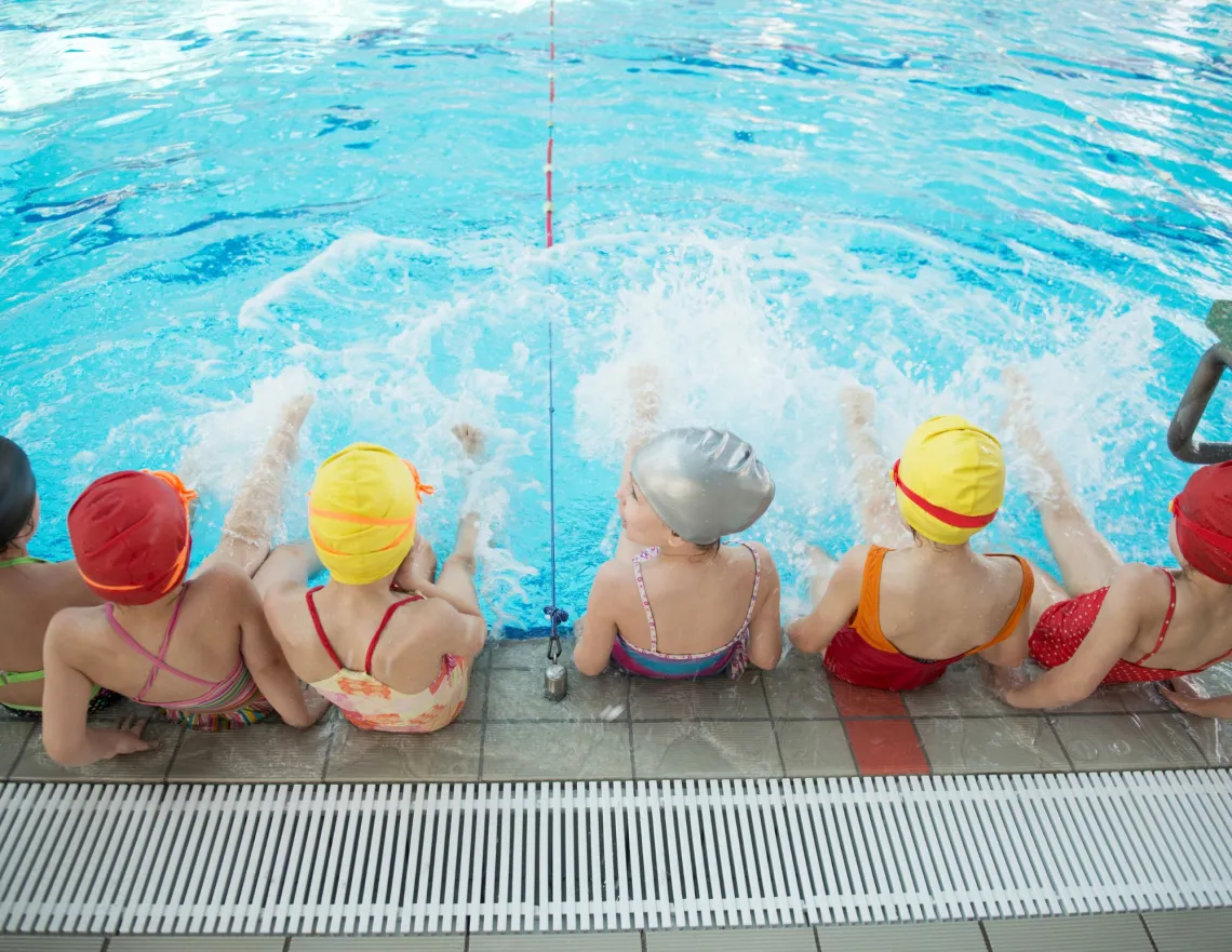 Kids at the edge of a pool