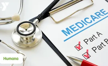 Photo of a clipboard with a pen and medicare verbiage